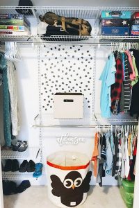 Even boys need organization ... that's why I set out to create this organized shared closet for brothers! Using a DIY closet system, we created a tiny but functional closet for boys who share a room. Click to see more!